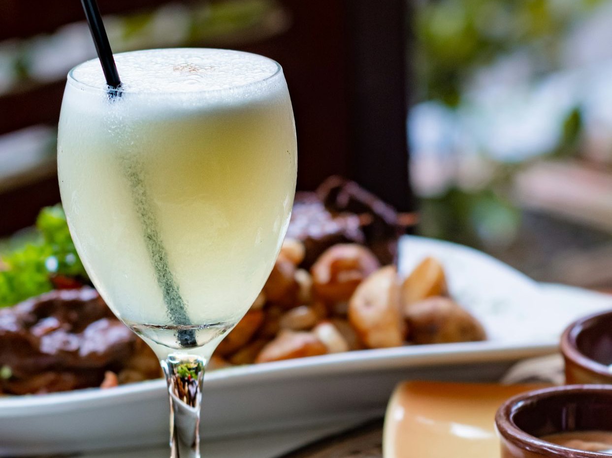 clear wine glass with yellow liquid